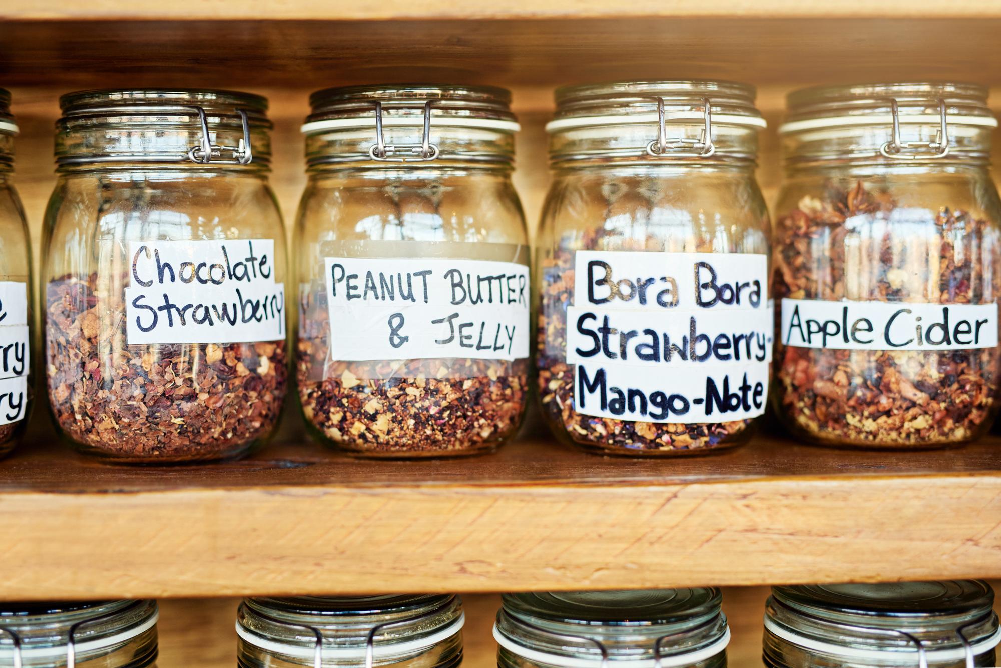 Row of glass jars with labeled ingredients